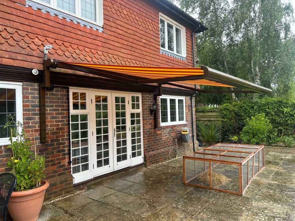 Awning On Bespoke Brackets Over Tile Hung Wall